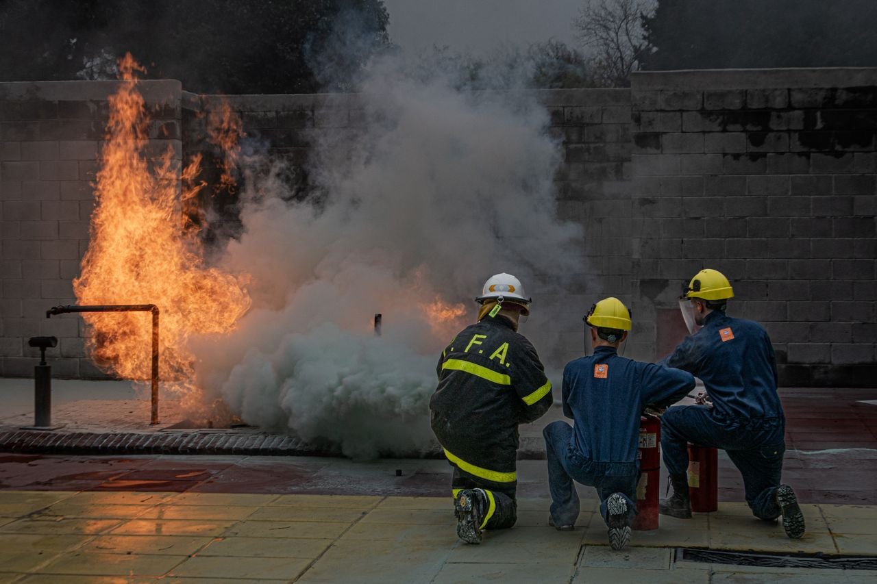 services-02 Firefighters engage in a controlled training exercise to extinguish a blaze.